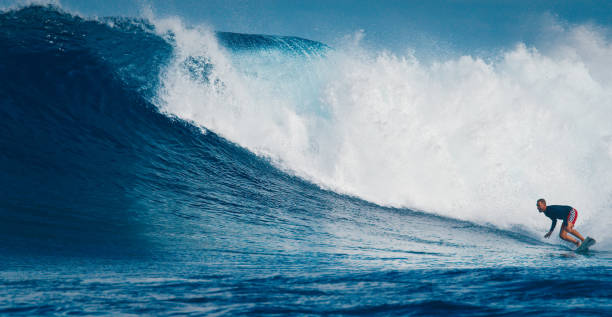 istock Pro surfer rides big wave in the Maldives 2193646558
