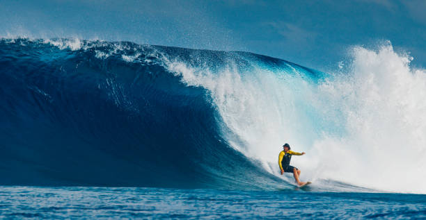 istock Pro surfer rides big wave in the Maldives 2193646559