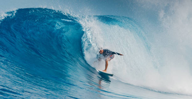 istock Pro surfer rides big wave in the Maldives 2193646561