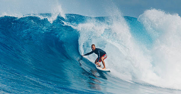 istock Pro surfer rides big wave in the Maldives 2193646564