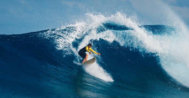 Pro surfer rides big wave in the Maldives