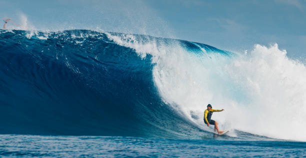 istock Pro surfer rides big wave in the Maldives 2193646575
