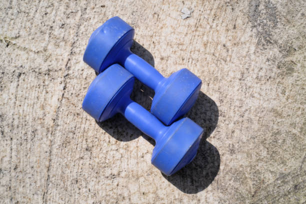 Rows of different dumbbell weights at a gym