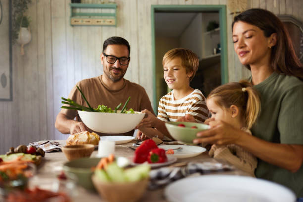 Happy family having a meal in dining room.