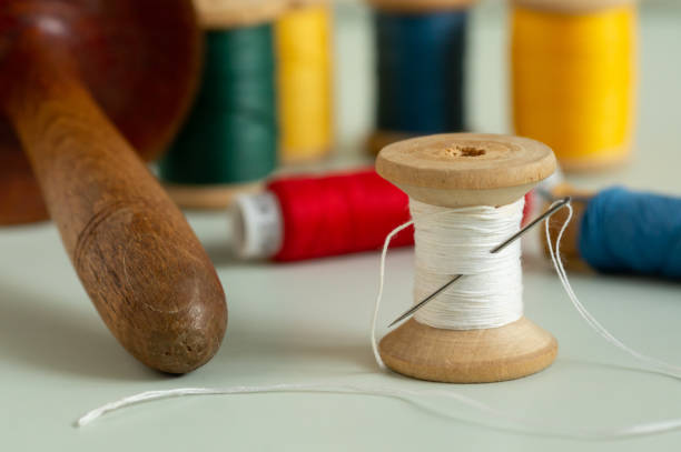 istock Real old spools of needle and thread meter close-up 2193651045