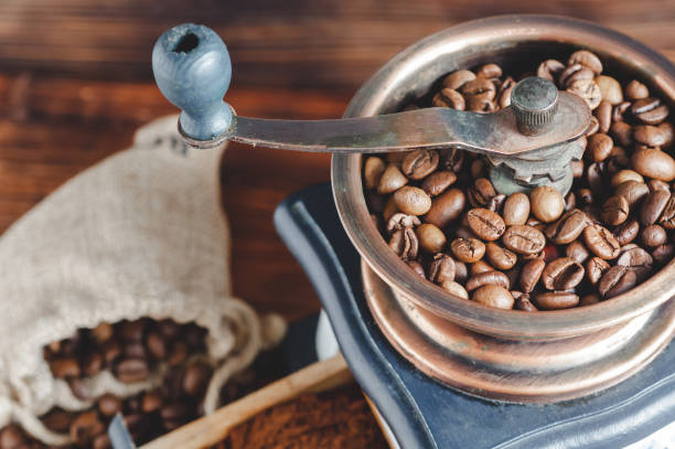istock Vintage coffee grinder, coffee beans on wooden background 2193651061