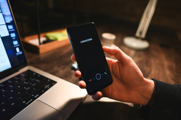 istock call from unknown number. Scam alert on mobile phone 2193651176