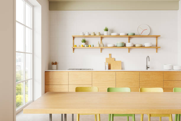 istock Modern kitchen interior with wooden cabinets, shelves, and table, featuring colorful chairs and clean decor on a bright background. 3D Rendering 2193652689