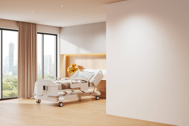 istock Modern hospital room with empty wall and sunlight through large windows for mockup template purposes. 3D Rendering 2193652783