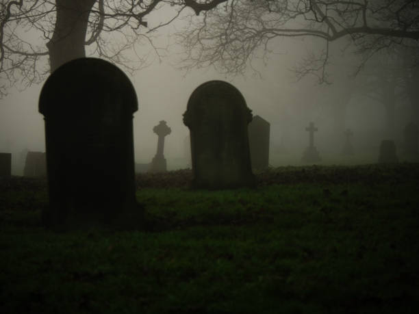 istock Eerie Graveyard in thick fog and mist 2193654749