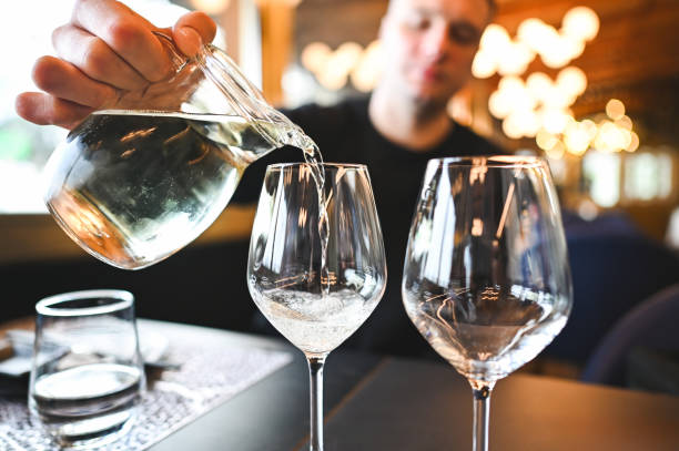 istock Close up of pouring white wine. 2193657359
