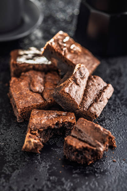 istock Homemade chocolate brownies on black table. 2193660478