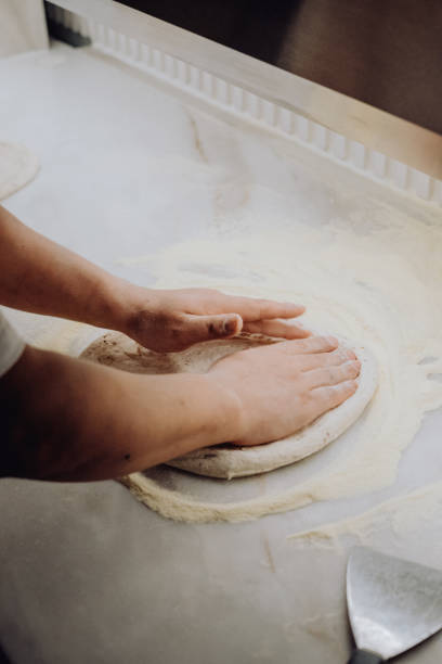 istock Pizza Dough Preparation: Kneading and Shaping 2193665425