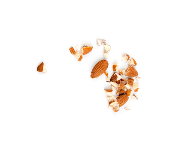 istock Crushed almonds isolated, nut pieces, sliced scattered almond seeds and cut kernels collection on white background 2193668299