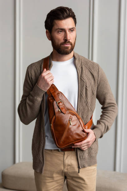 istock A Stylish and Professional Man Standing with a yellow brown hip pack 2193668907