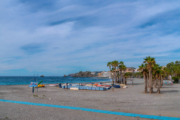 istock Almunecar beach Spain with palm trees and boats 2193669588