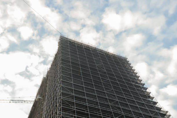 istock Metal Scaffolding on Building Facade, industrial framework, structural design, repair project 2193670375