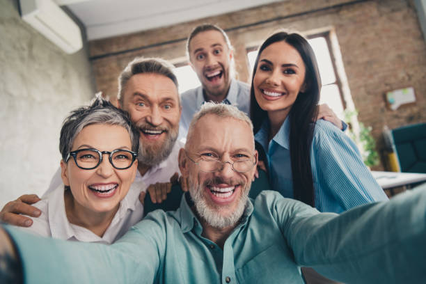 istock Photo of teamwork people working together take selfie photo teamwork comfortable modern office loft room interior indoors workspace 2193670596