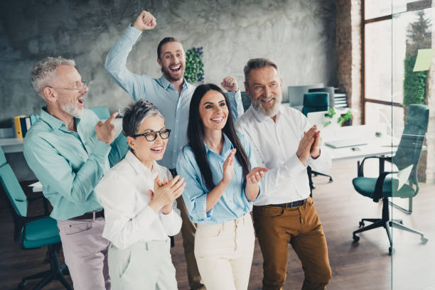 istock Photo of teamwork people working together celebrate applause comfortable modern office loft room interior indoors workspace 2193670899