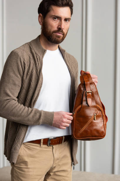 istock A Stylish and Professional Man Standing with a yellow brown hip pack 2193671200