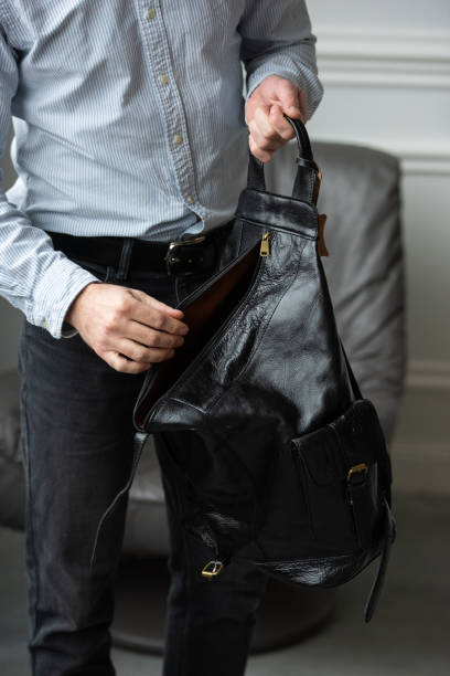 istock A Stylish and Professional Man Standing with a Bag in a Contemporary Modern Setting 2193671837