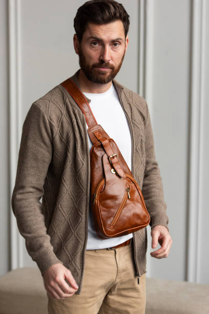istock A Stylish and Professional Man Standing with a yellow brown hip pack 2193672798