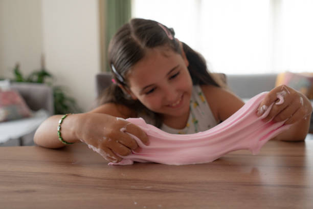 istock Girl playing with sticky slime 2193677462