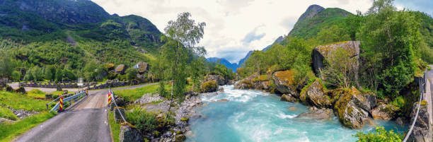 Glacier on mountain. Snow. Winter. Picturesque landscape in Norway. Beautiful north nature. Scandinavia. Adventure in mountains. Norwegian climate