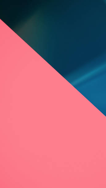 istock A minimalist abstract background featuring a diagonal split between vibrant coral pink and deep teal, ideal for modern designs and visual content. 2193679144