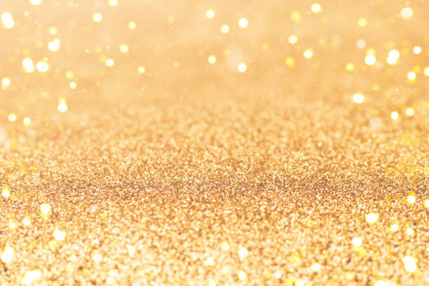 istock Golden Glittery Surface With Shimmering Lights and Bokeh Effects 2193681542
