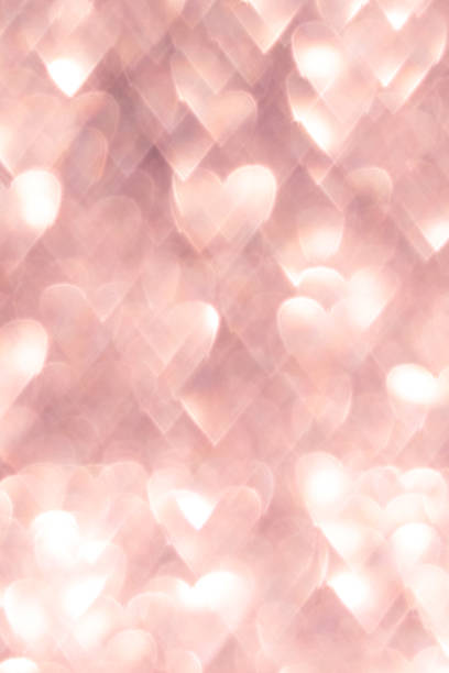 istock Pink abstract background with heart shaped bokeh lights creating a romantic vibe 2193681548