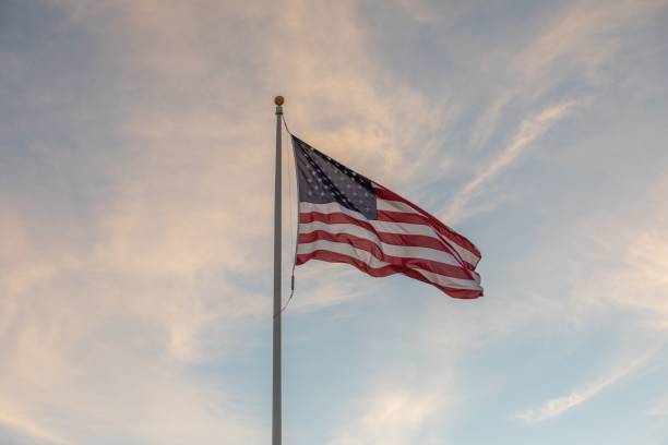 istock American flag waving at sunset 2193681868