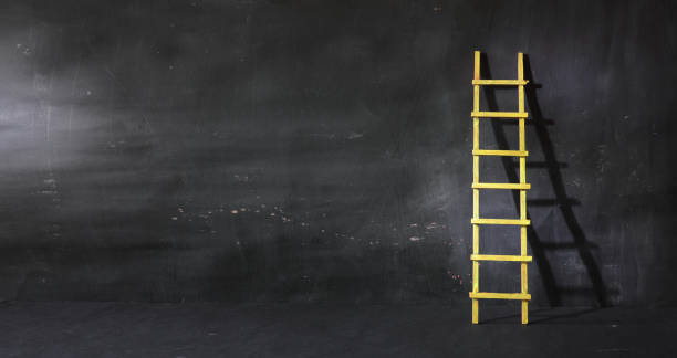istock Creativity,solution,innovation,idea,thinking out of the box concept, dark wall with ladder of success. Large free copy space,negative space technique 2193683030