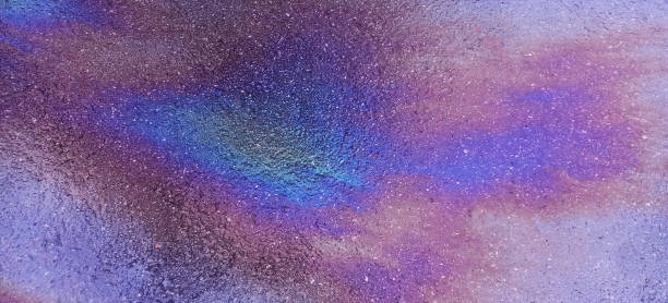 istock multicolor gasoline benzine stain on asphalt road surface 2193687676