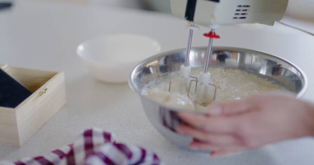 istock Woman Using Mixer and Mixing Pancake Batter in Bowl 2193689845