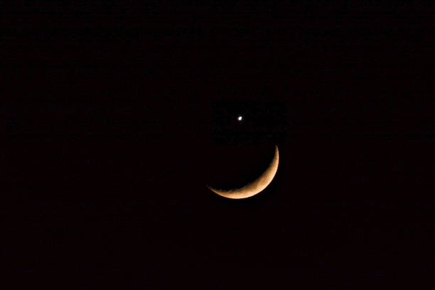 istock Half-moon and Sirius. Moon in the night sky. Shining star and crescent moon 2193691269