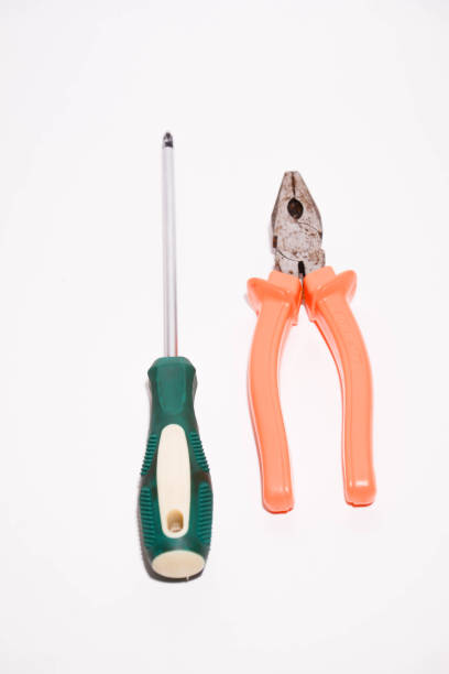 istock Screwdriver and pliers isolated on a white background. Pliers and screwdriver. Work tools 2193691471
