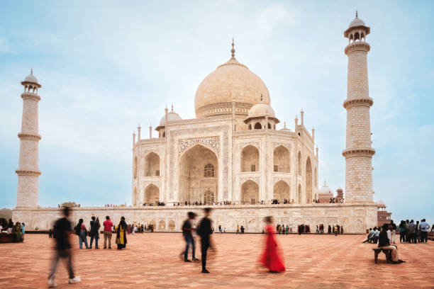 istock motion blurred people in front of taj mahal in agra 2193695002