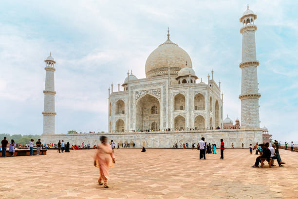 istock motion blurred people in front of taj mahal in agra 2193695079