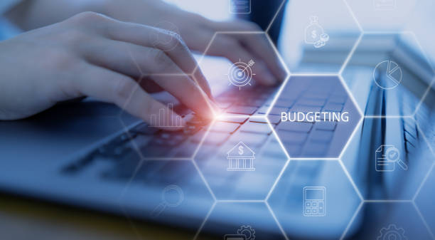 istock Budget planning and financial management oncept. Typing and using laptop for budget planning and allocation. Effective budgeting. Plan, review, approve, allocate, analyze, optimize budgets. 2193695475