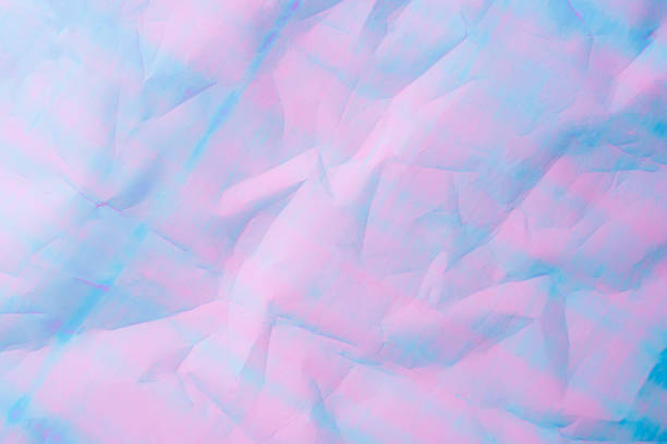 istock An abstract background featuring pastel hues of pink and blue 2193696740