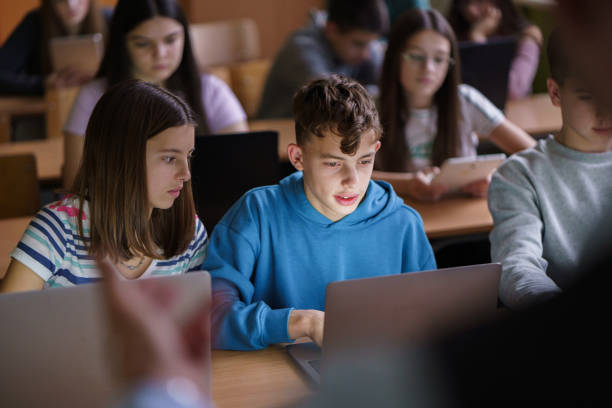 istock Teenagers whit laptop studying in the classroom 2193696922