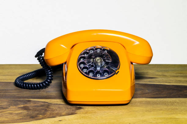 istock Old telephone on wooden desk 2193703332