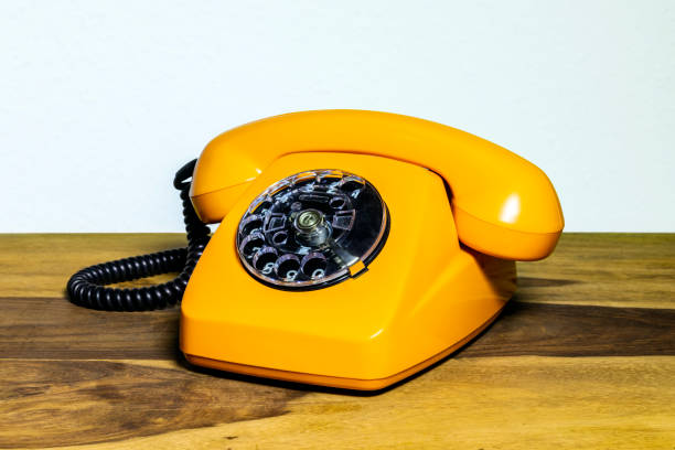 istock Old telephone on wooden desk 2193703341