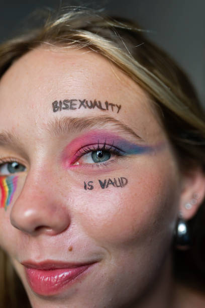 istock Young lesbian woman with bright makeup looking at camera 2193703421