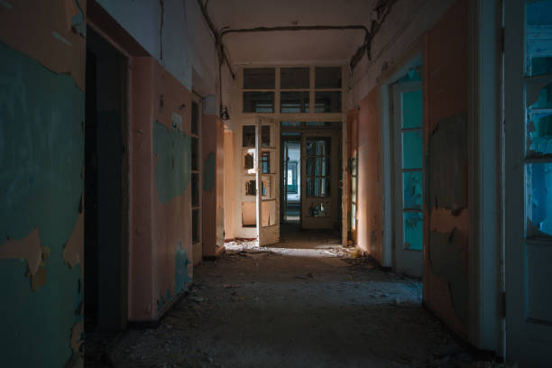 istock Dark creepy corridor of abandoned building 2193703637