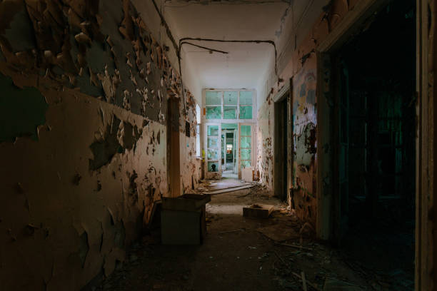 istock Dark creepy corridor of abandoned building 2193703644