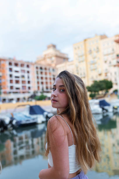 istock Charming young woman in city in evening 2193704693