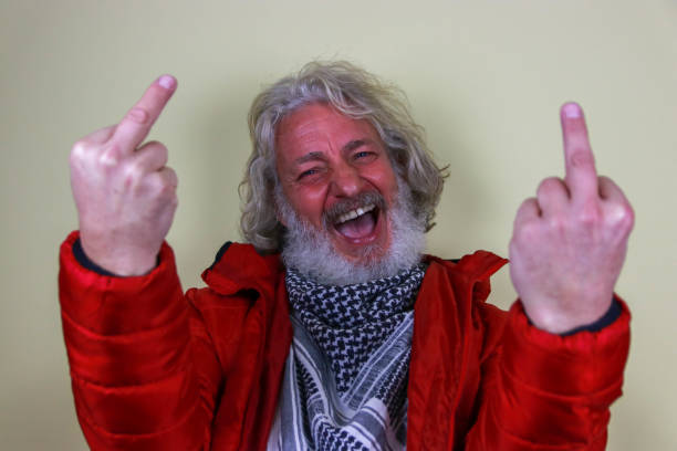 istock Bearded man in red jacket show sign with hand 2193704871