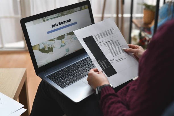 istock Female Holding Printed CV In Hands Before Applying for Job Online 2193707131